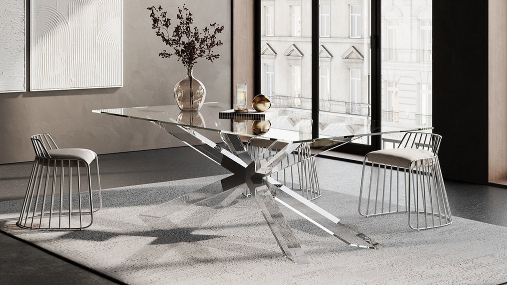 A transparent star-shaped acrylic table base with glass tabletop