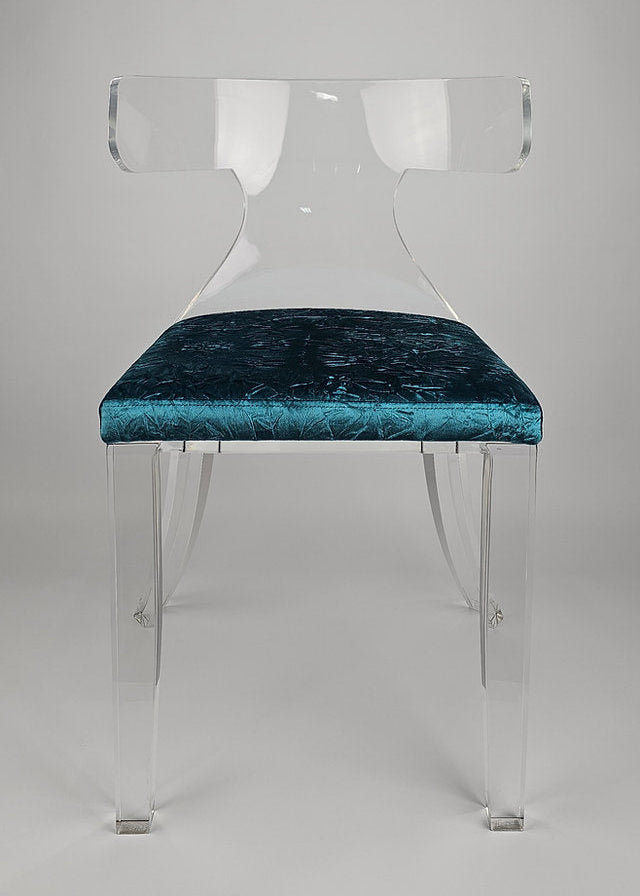 Clear acrylic dining chair with green velvet upholstery