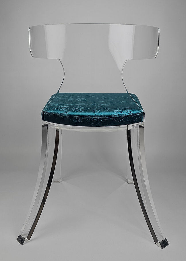 Clear acrylic dining chair with green velvet upholstery