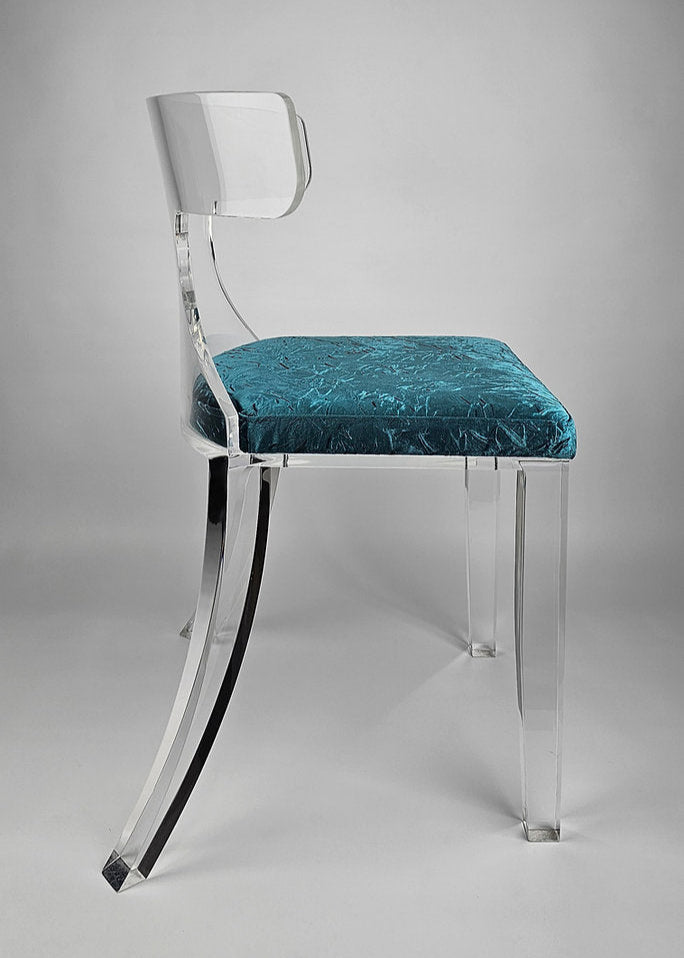 Clear acrylic dining chair with green velvet upholstery