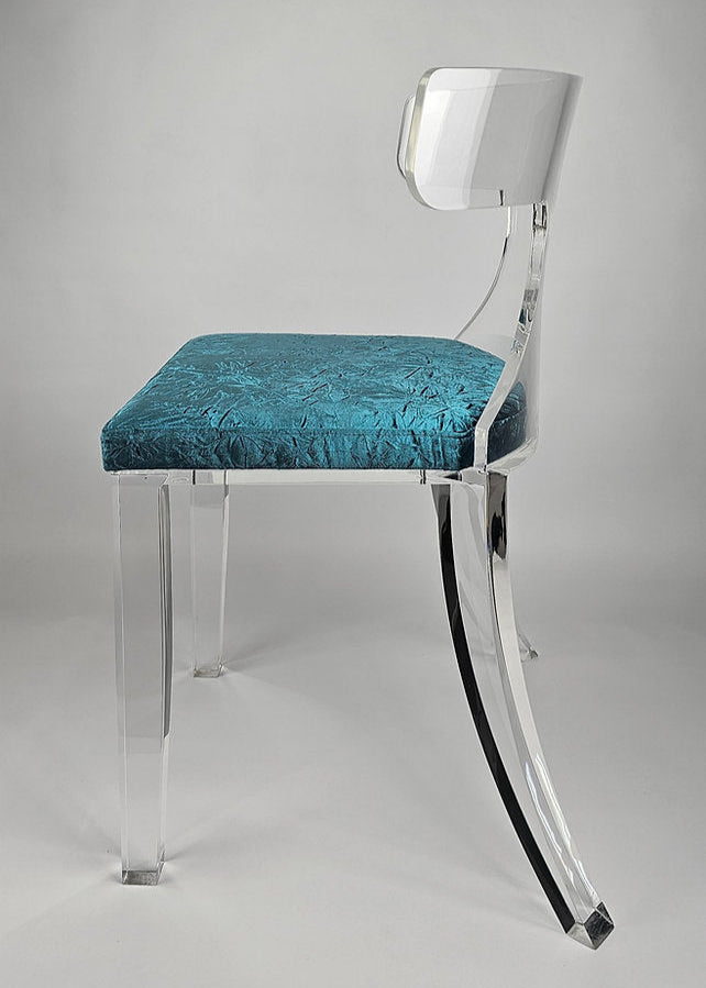 Clear acrylic dining chair with green velvet upholstery