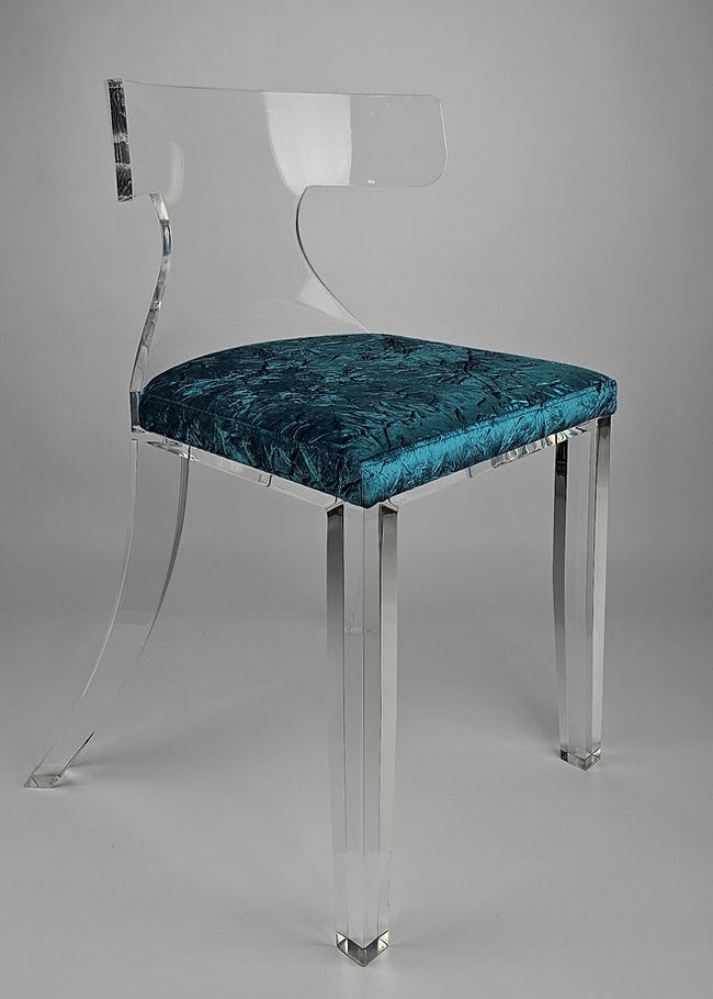 Clear acrylic dining chair with green velvet upholstery