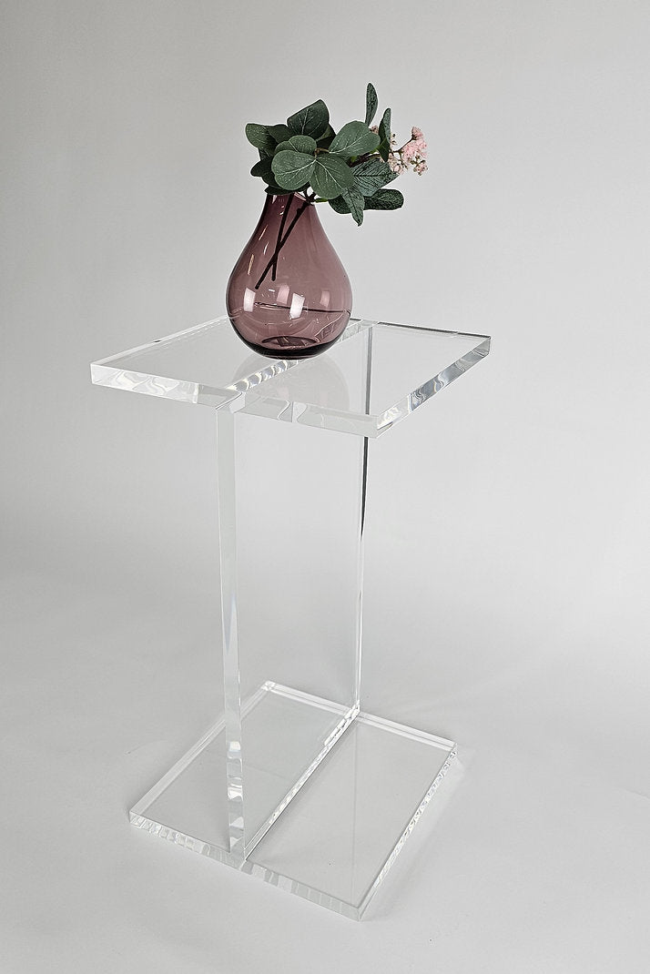 Clear acrylic end table with a minimalist I-beam design