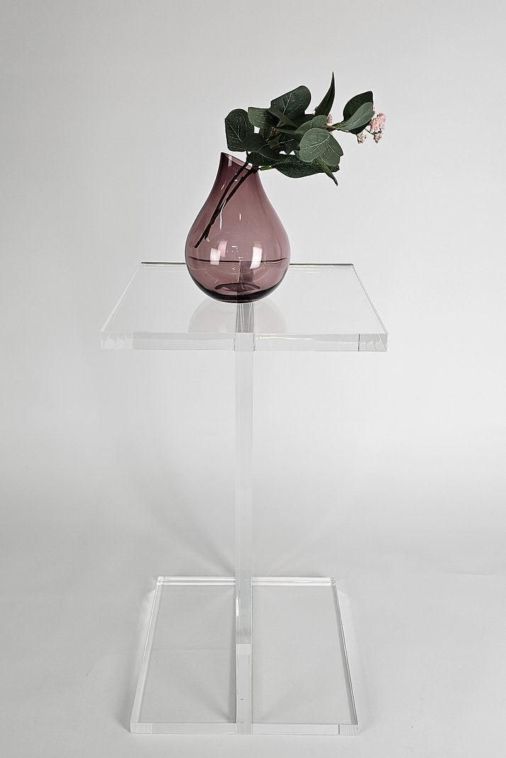 Clear acrylic end table with a minimalist I-beam design