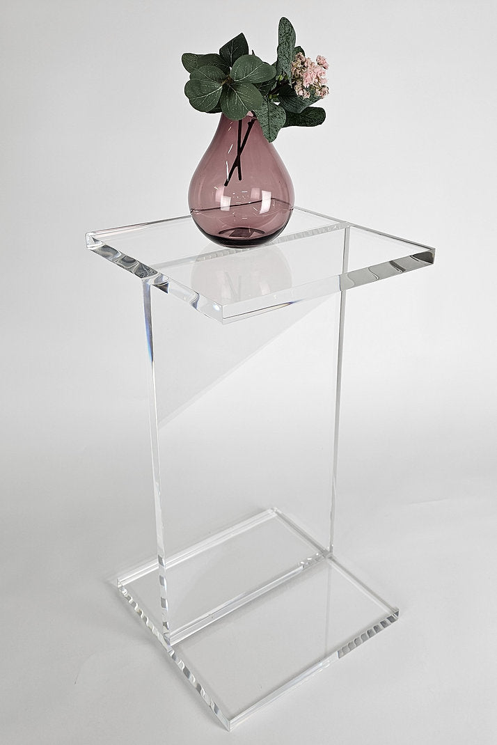 Clear acrylic end table with a minimalist I-beam design