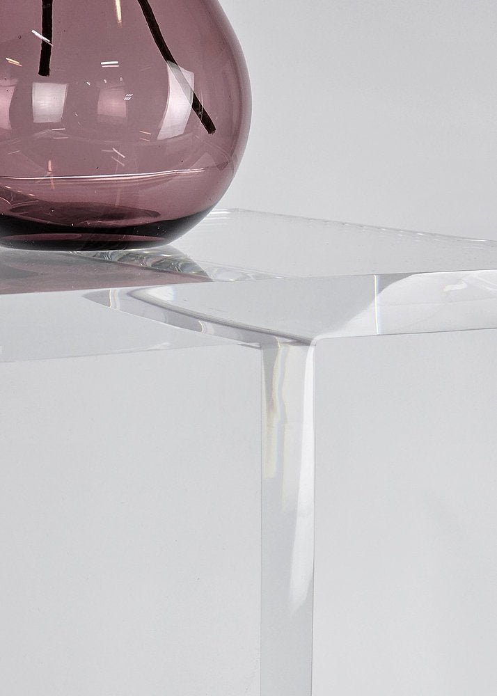 Clear acrylic end table with a minimalist I-beam design