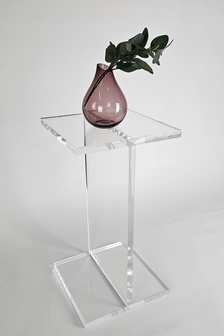 Clear acrylic end table with a minimalist I-beam design
