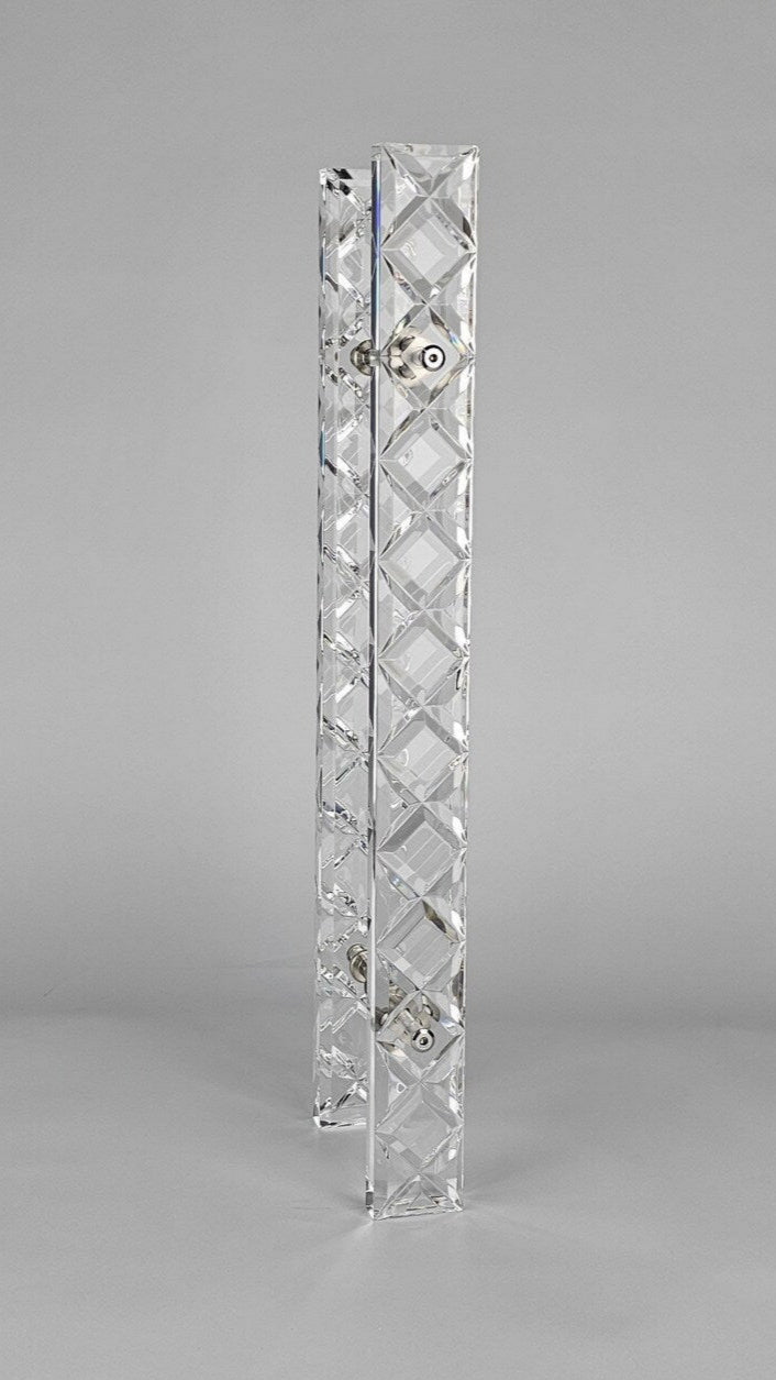 Clear acrylic door pull with a criss-cross pattern and chrome or gold accents