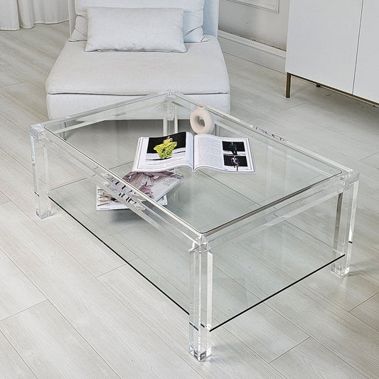 Clear acrylic coffee table with a minimalist style and lower shelf