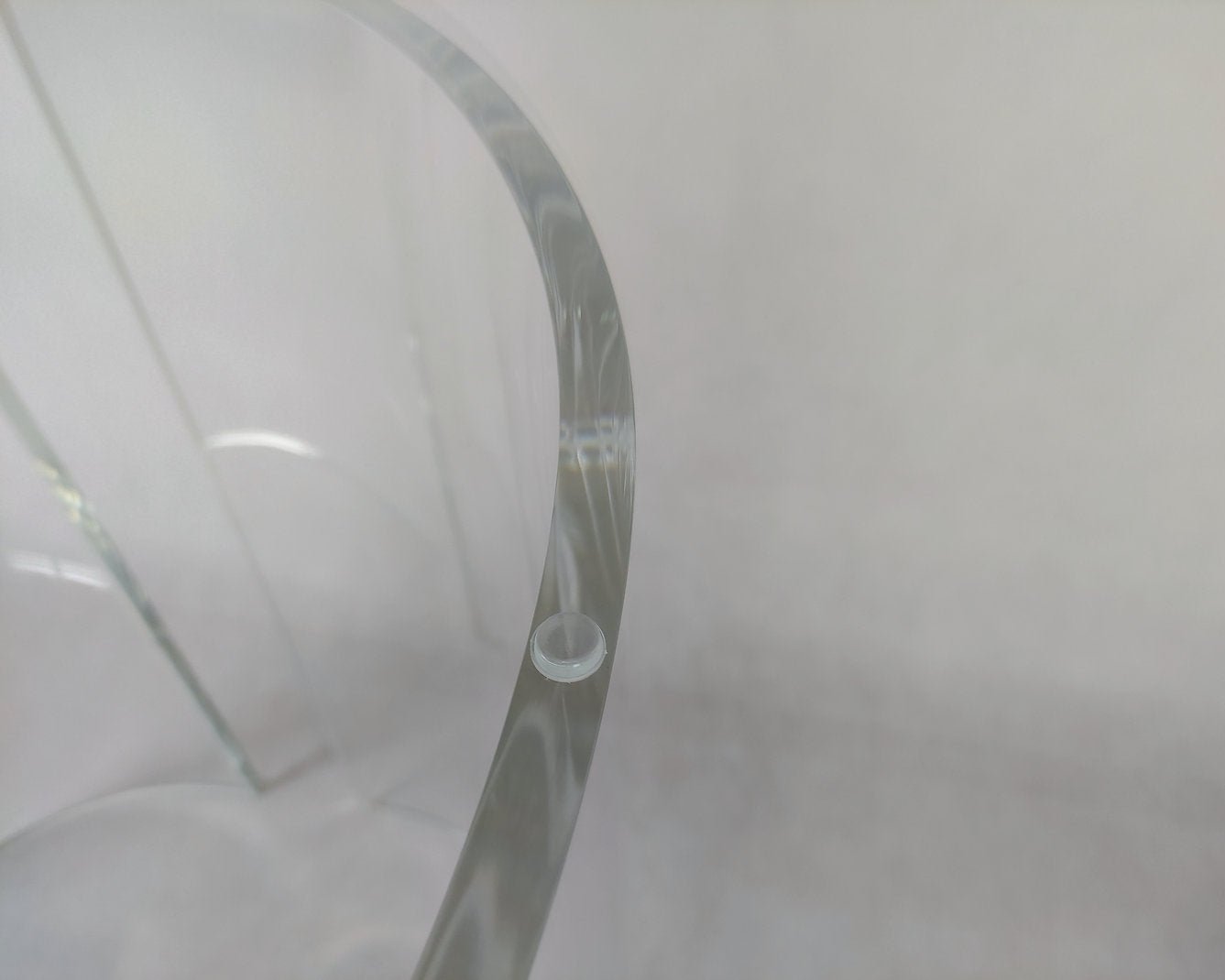 Clear acrylic table base with a c-shaped cross section