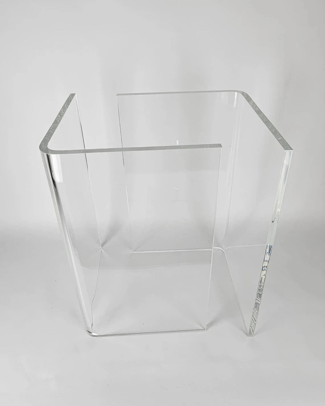 Clear acrylic table base with a v-shaped cross section