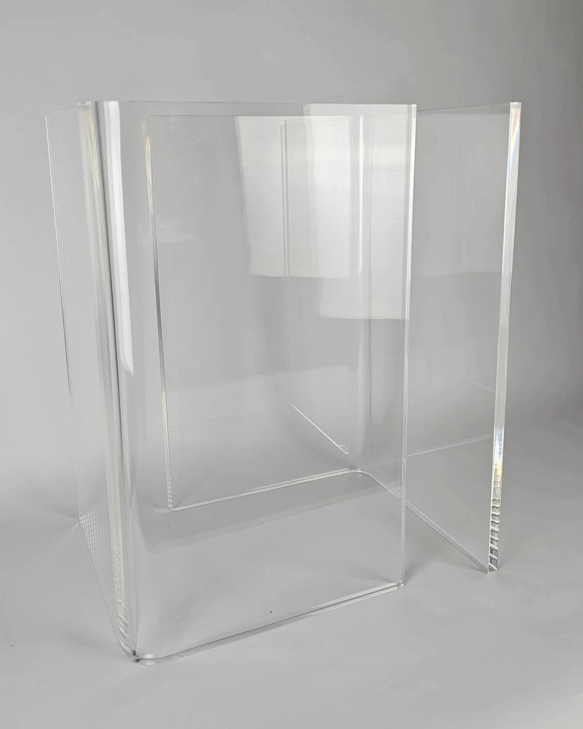 Clear acrylic table base with a v-shaped cross section
