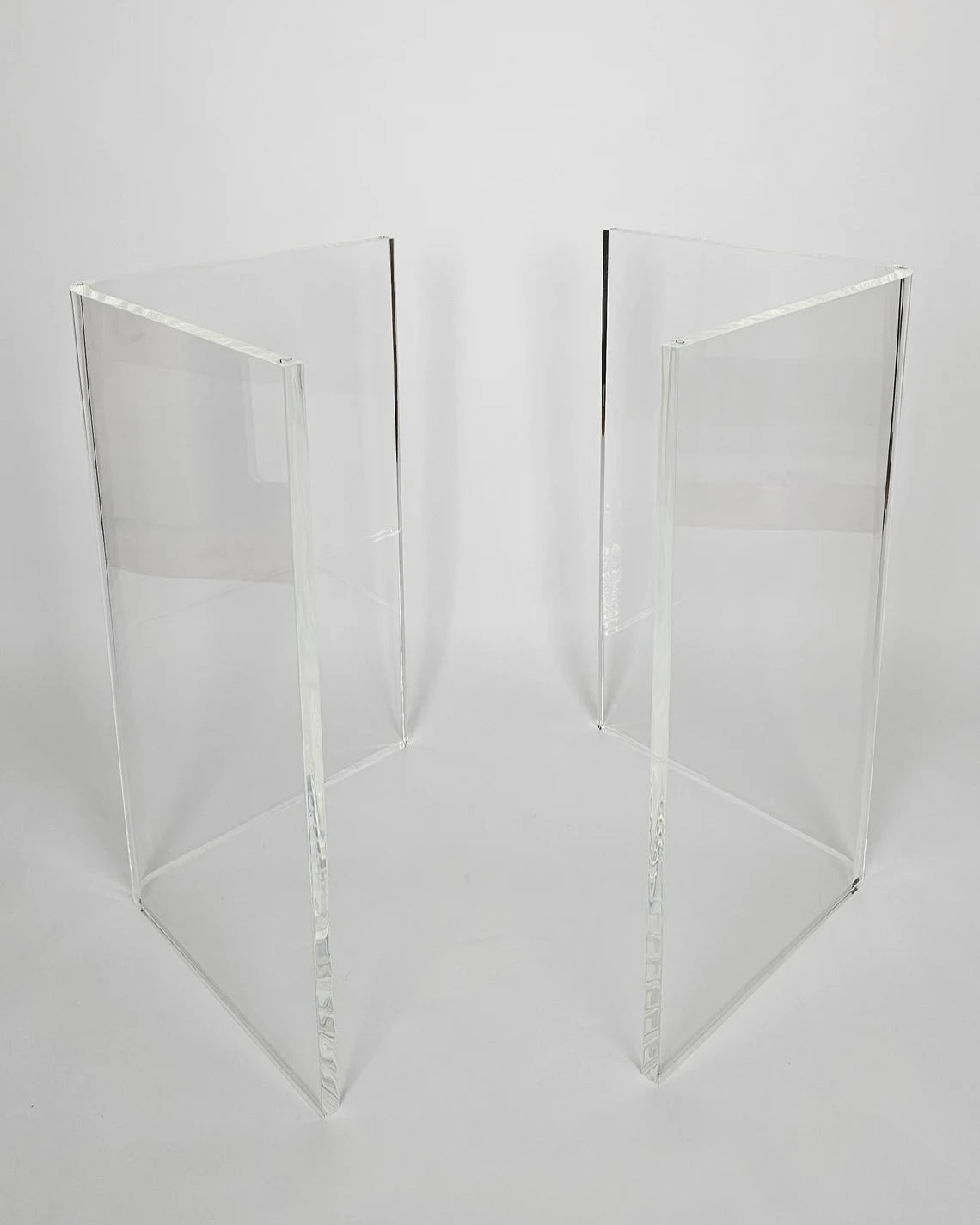 Clear acrylic table base with a v-shaped cross section