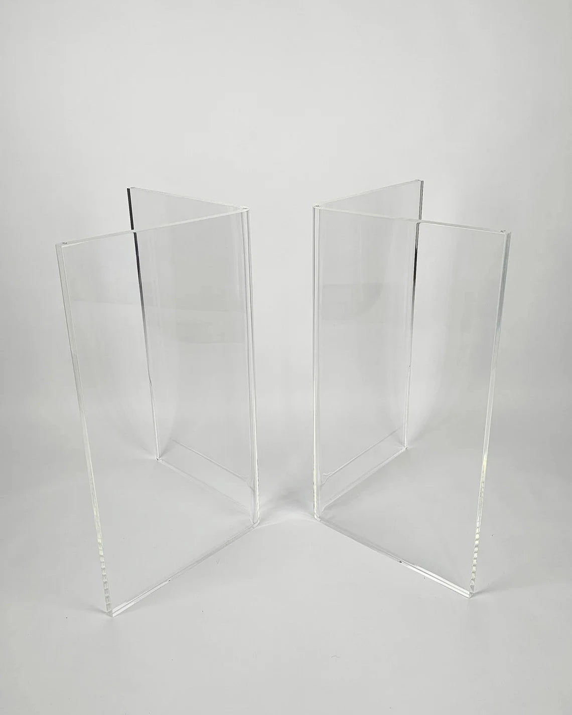 Clear acrylic table base with a v-shaped cross section