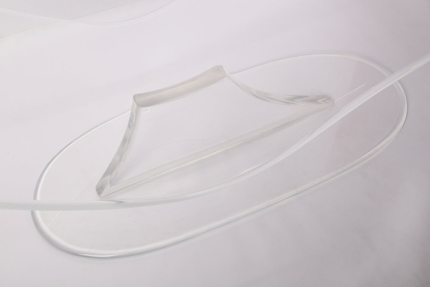 Clear acrylic lounge chair with a wavy profile
