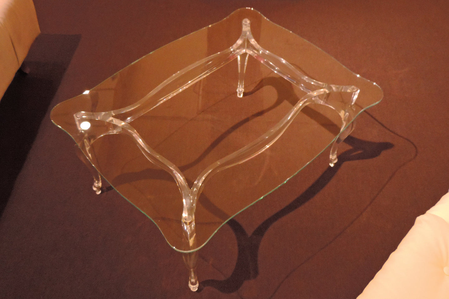 Clear acrylic coffee table with a regal and elegant style