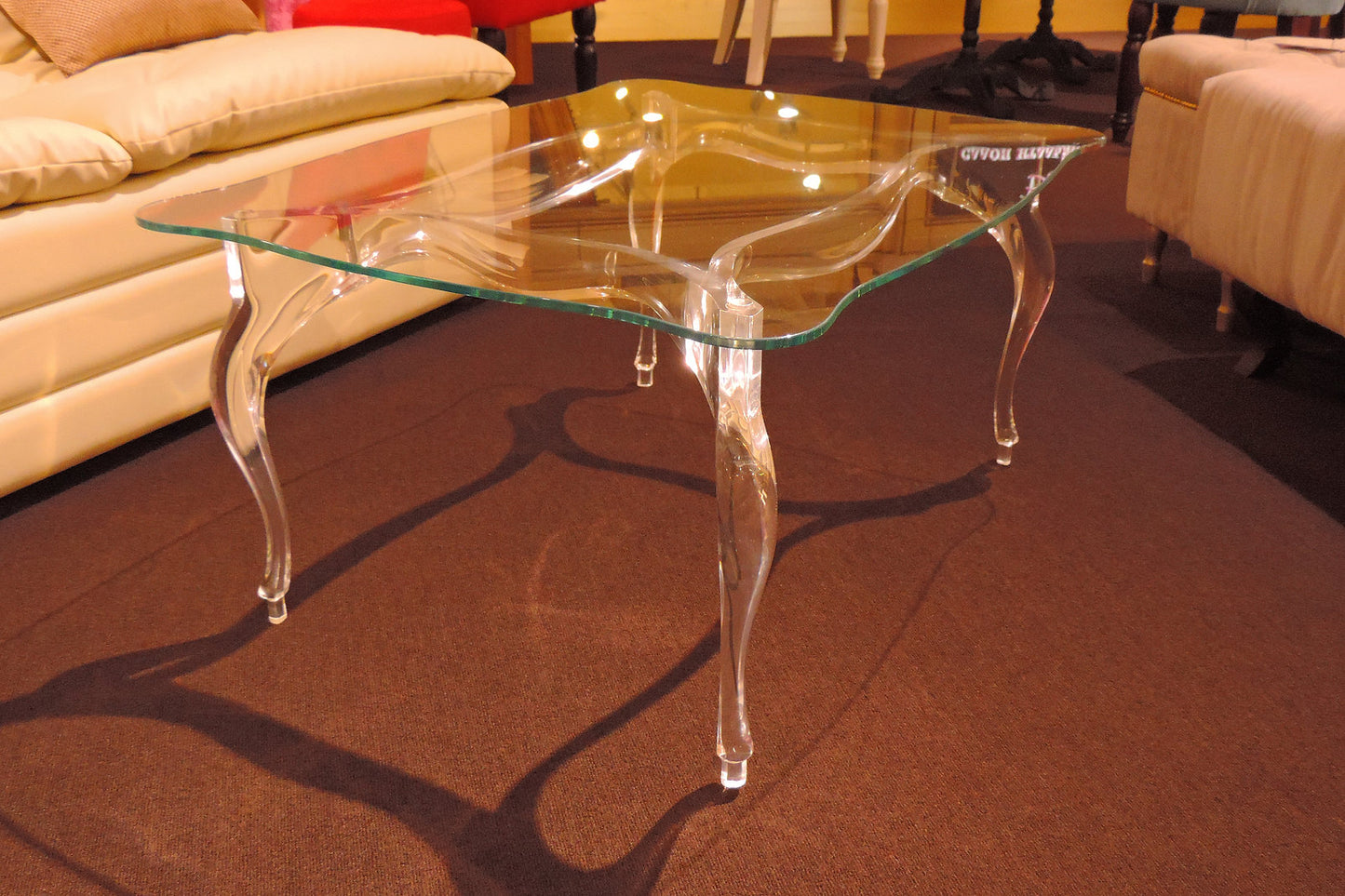 Clear acrylic coffee table with a regal and elegant style