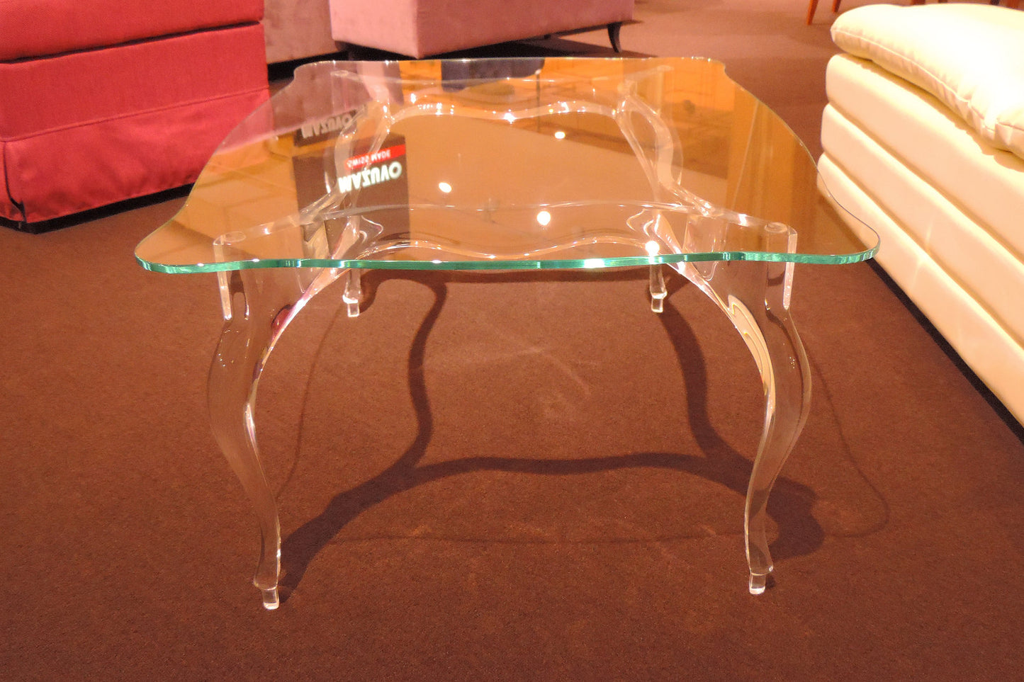 Clear acrylic coffee table with a regal and elegant style