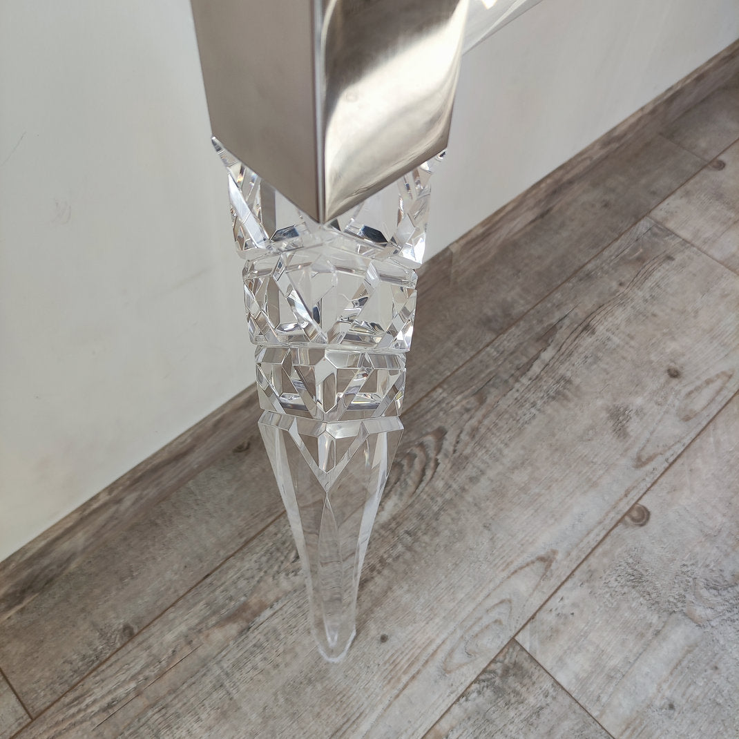 Clear acrylic console table with chrome accents