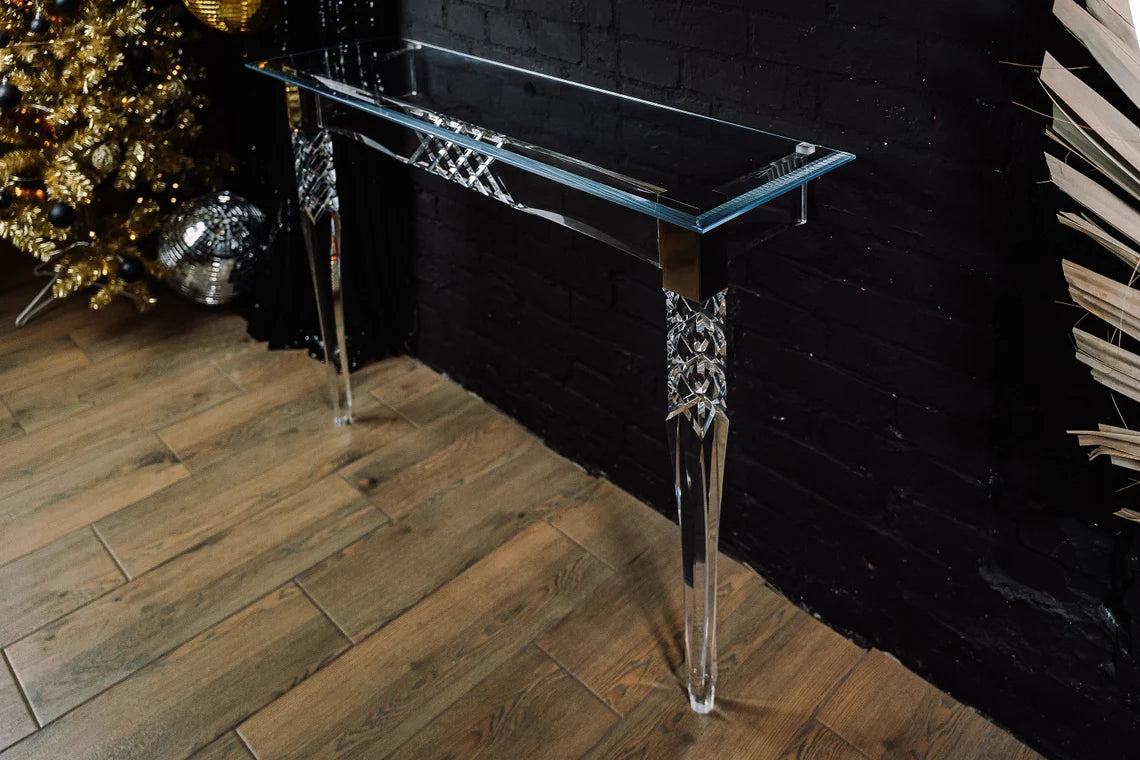 Clear acrylic console table with chrome accents