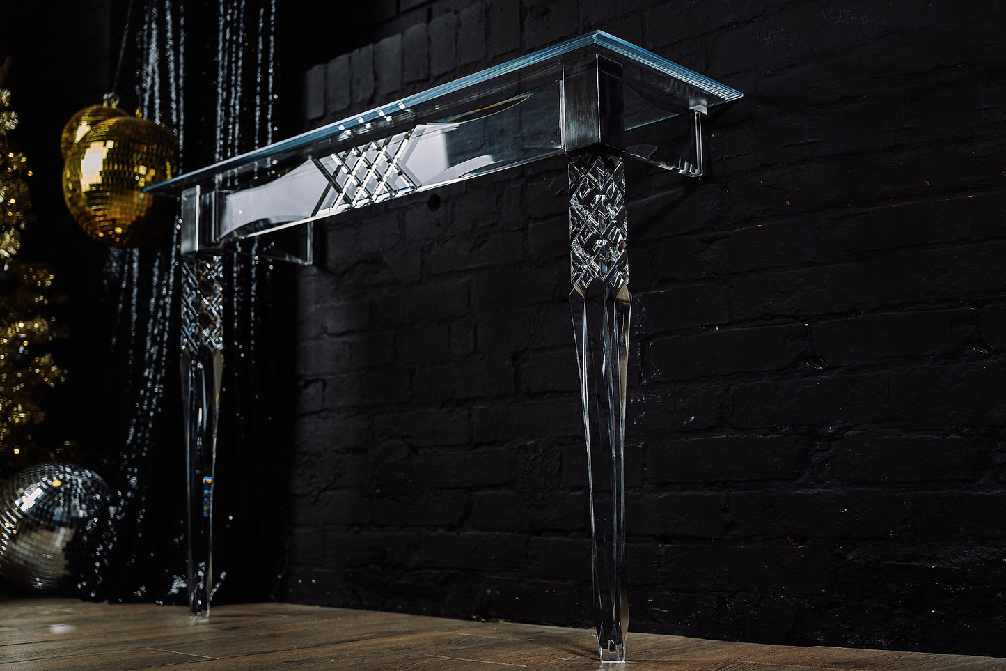 Clear acrylic console table with chrome accents