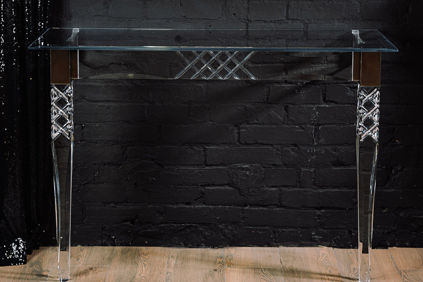 Clear acrylic console table with chrome accents