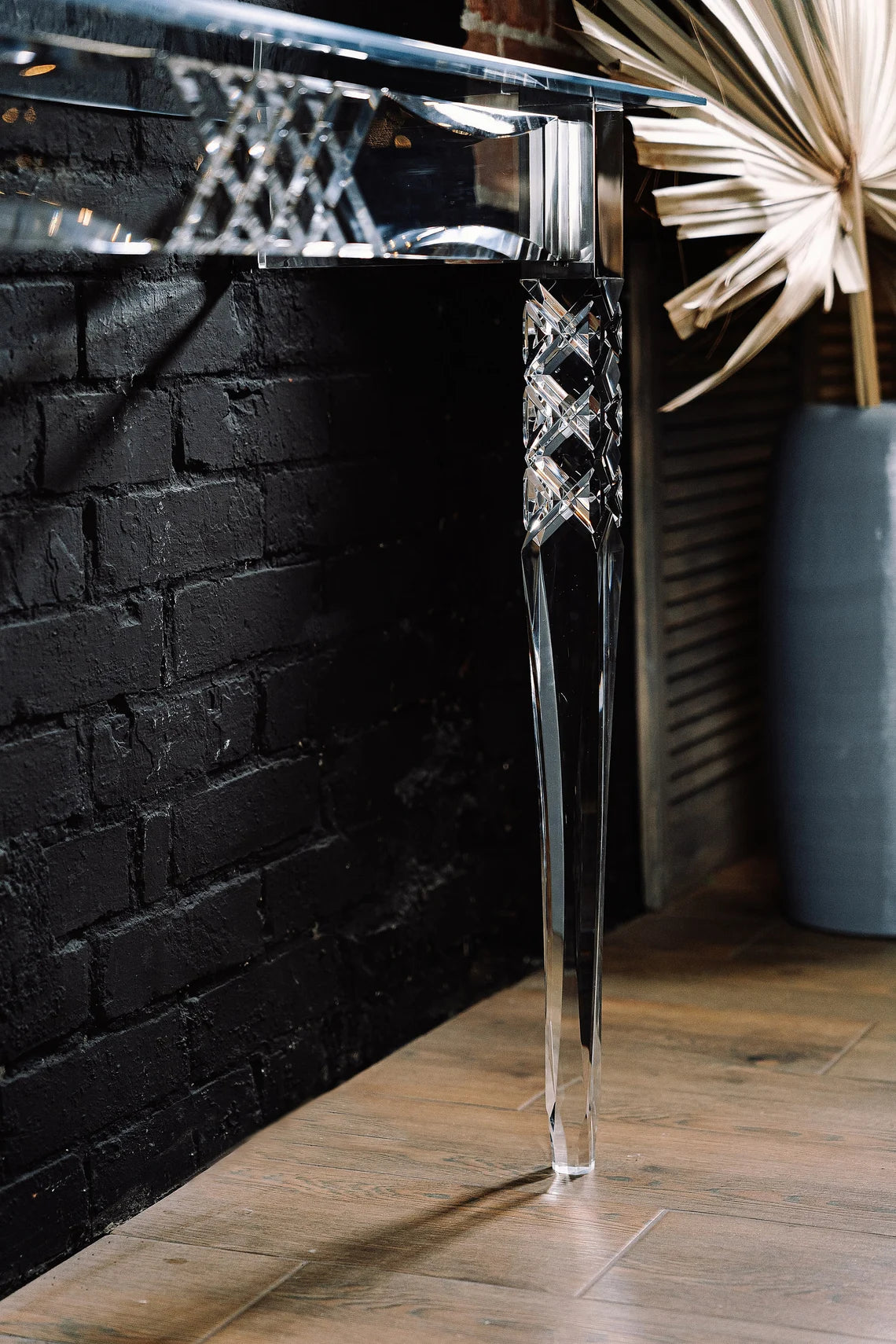 Clear acrylic console table with chrome accents