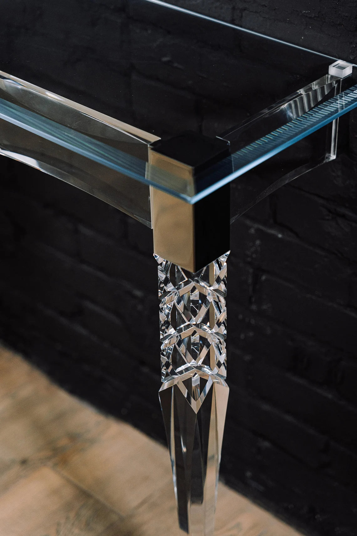 Clear acrylic console table with chrome accents