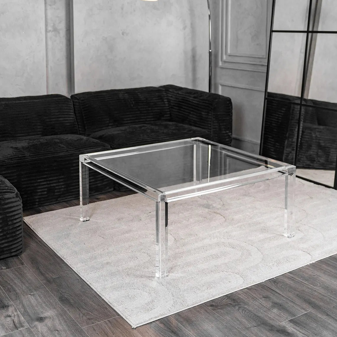 Clear acrylic coffee table with a minimalist rectangular style