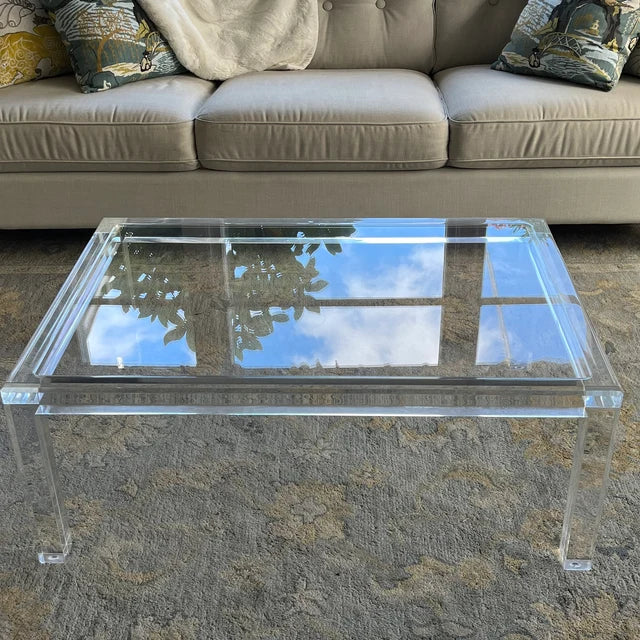 Clear acrylic coffee table with a minimalist rectangular style
