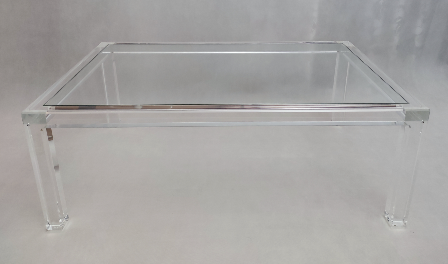 Clear acrylic coffee table with a minimalist rectangular style