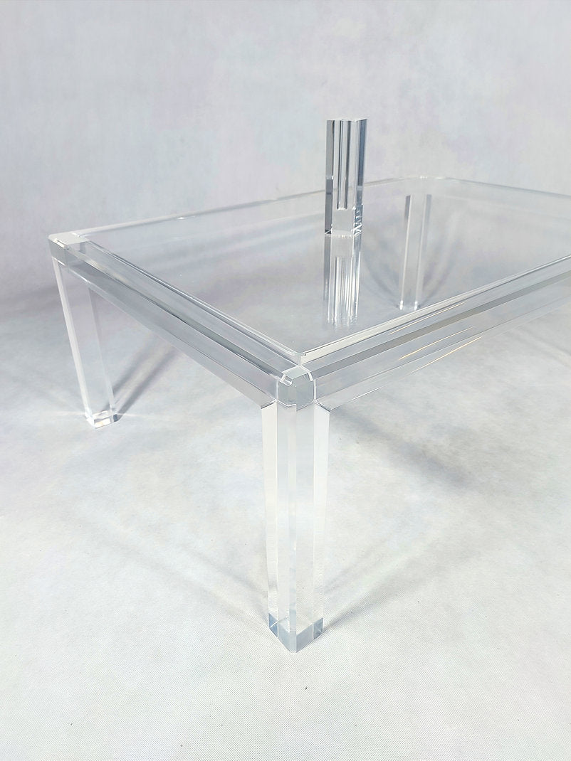 Clear acrylic coffee table with a minimalist rectangular style