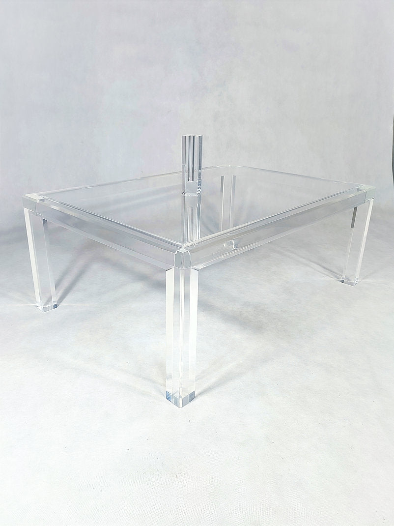 Clear acrylic coffee table with a minimalist rectangular style