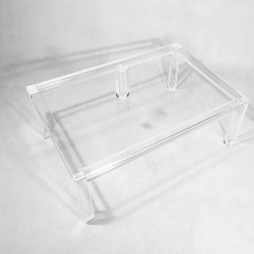 Clear acrylic coffee table with a minimalist rectangular style