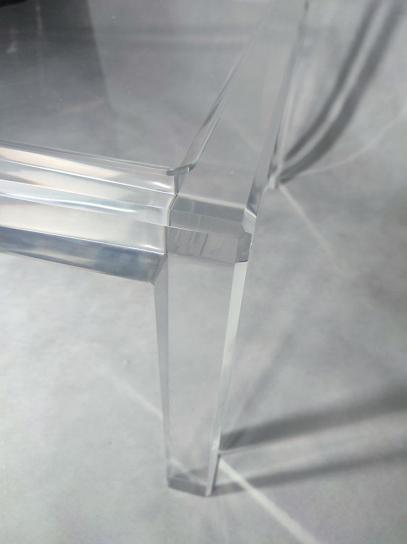Clear acrylic coffee table with a minimalist rectangular style