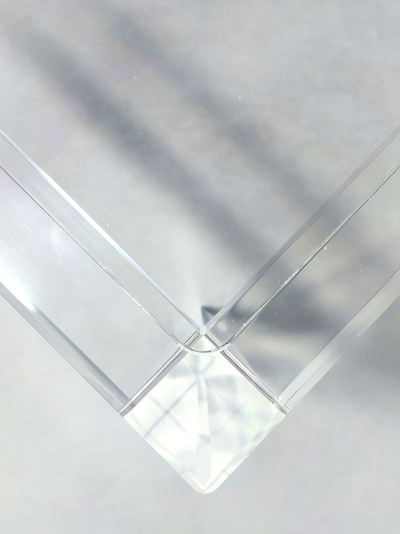 Clear acrylic coffee table with a minimalist rectangular style