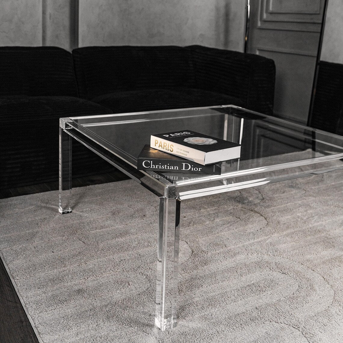 Clear acrylic coffee table with a minimalist rectangular style