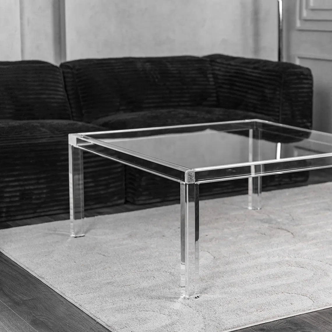 Clear acrylic coffee table with a minimalist rectangular style