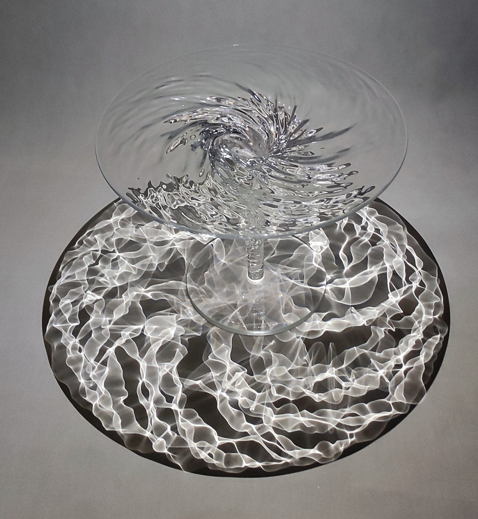 Clear acrylic coffee table that looks like a whirlpool
