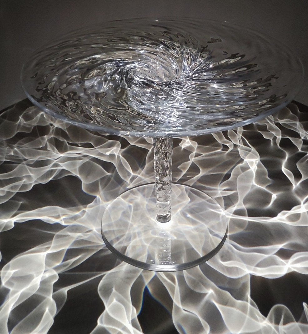 Clear acrylic coffee table that looks like a whirlpool