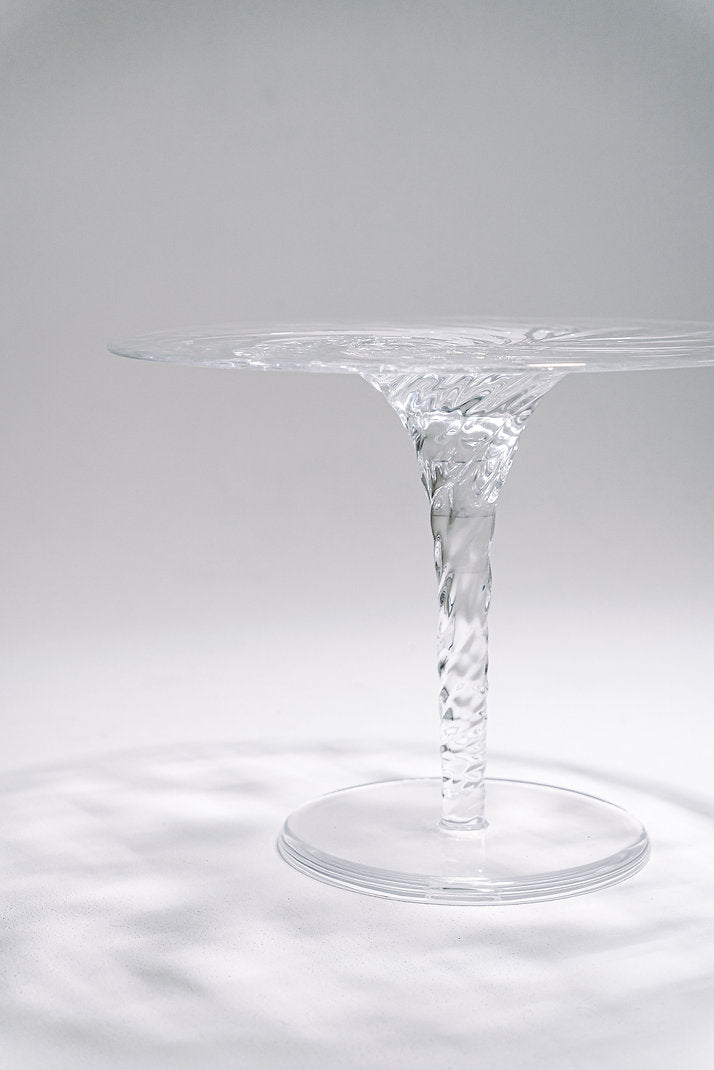 Clear acrylic coffee table that looks like a whirlpool