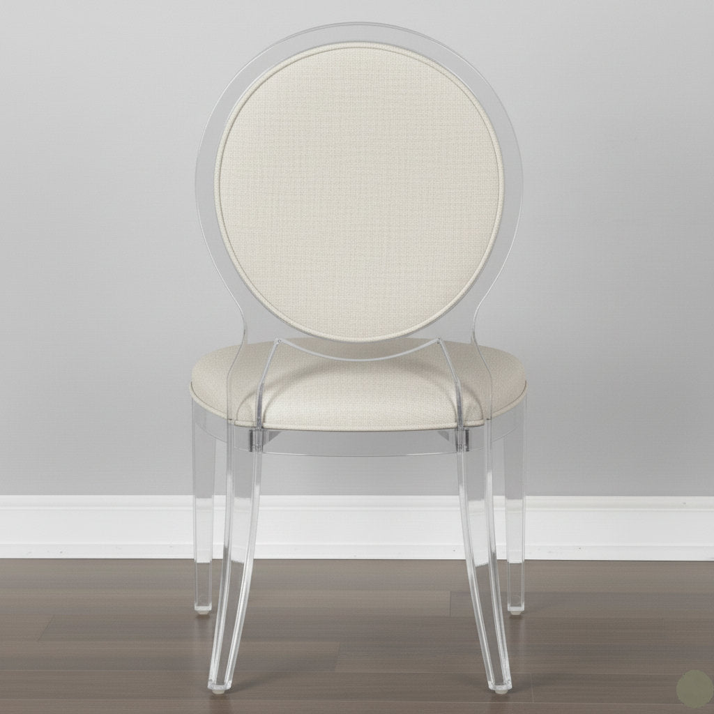 Clear acrylic chair with beige cushioned seat and backrest on a plain background