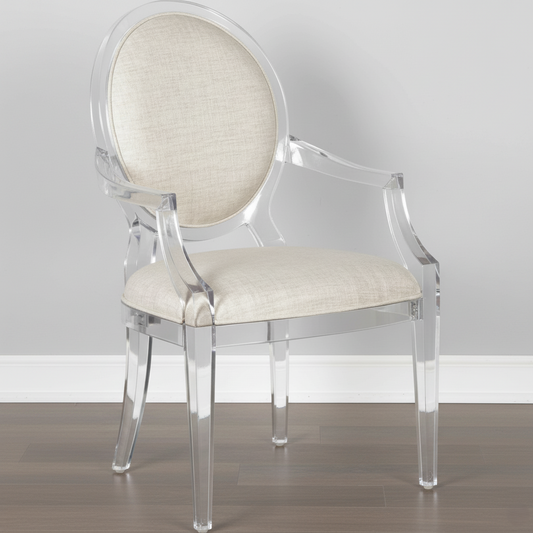 Clear acrylic chair with beige cushioned seat and backrest on a plain background