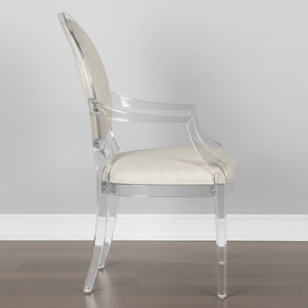 Clear acrylic chair with a white cushioned seat against a gray wall.