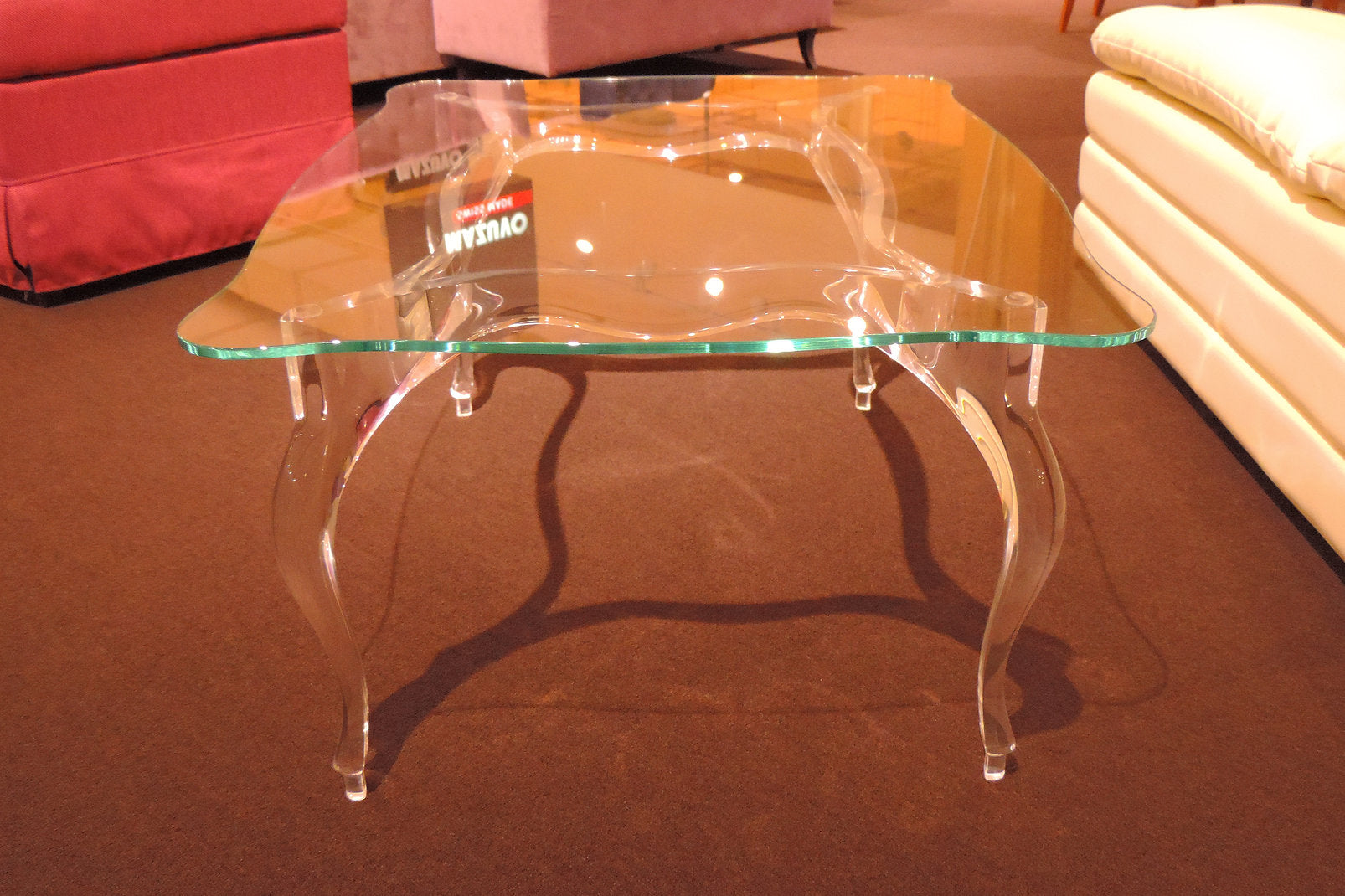 Clear acrylic coffee table with a regal and elegant style