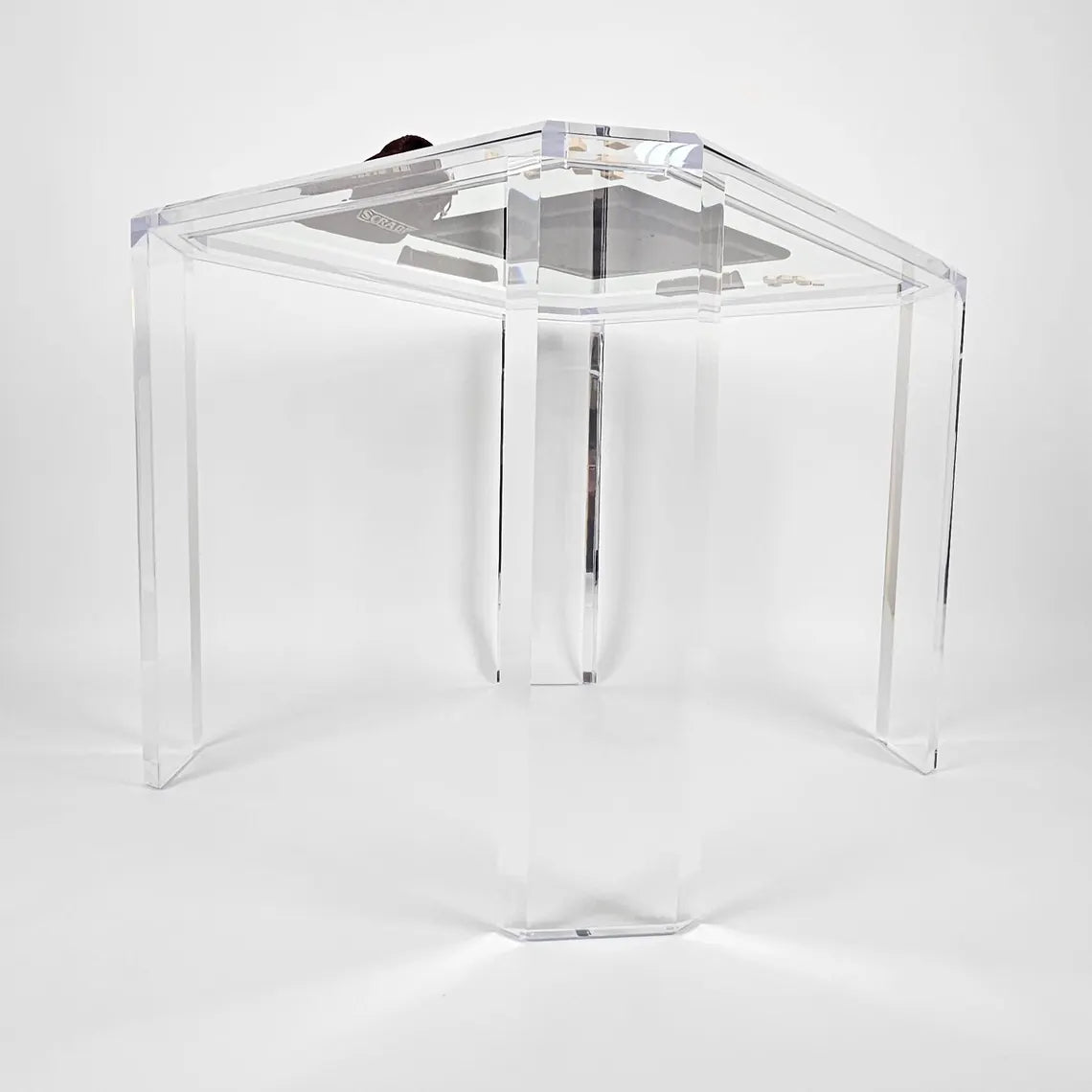 Clear acrylic game table with beveled edges and corners