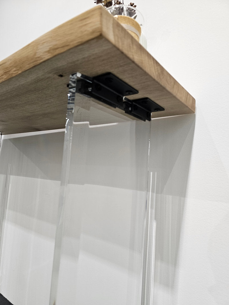 Clear acrylic console table with a light wood top