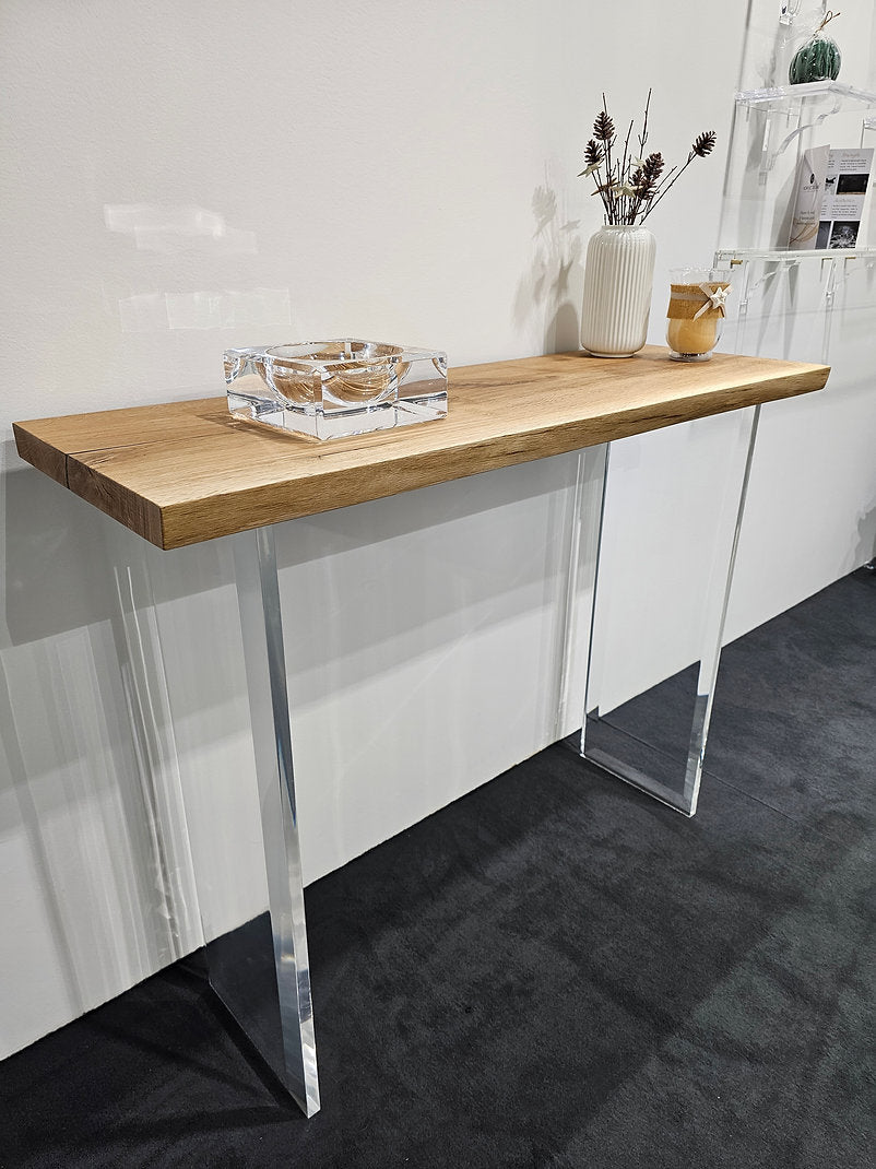 Clear acrylic console table with a light wood top