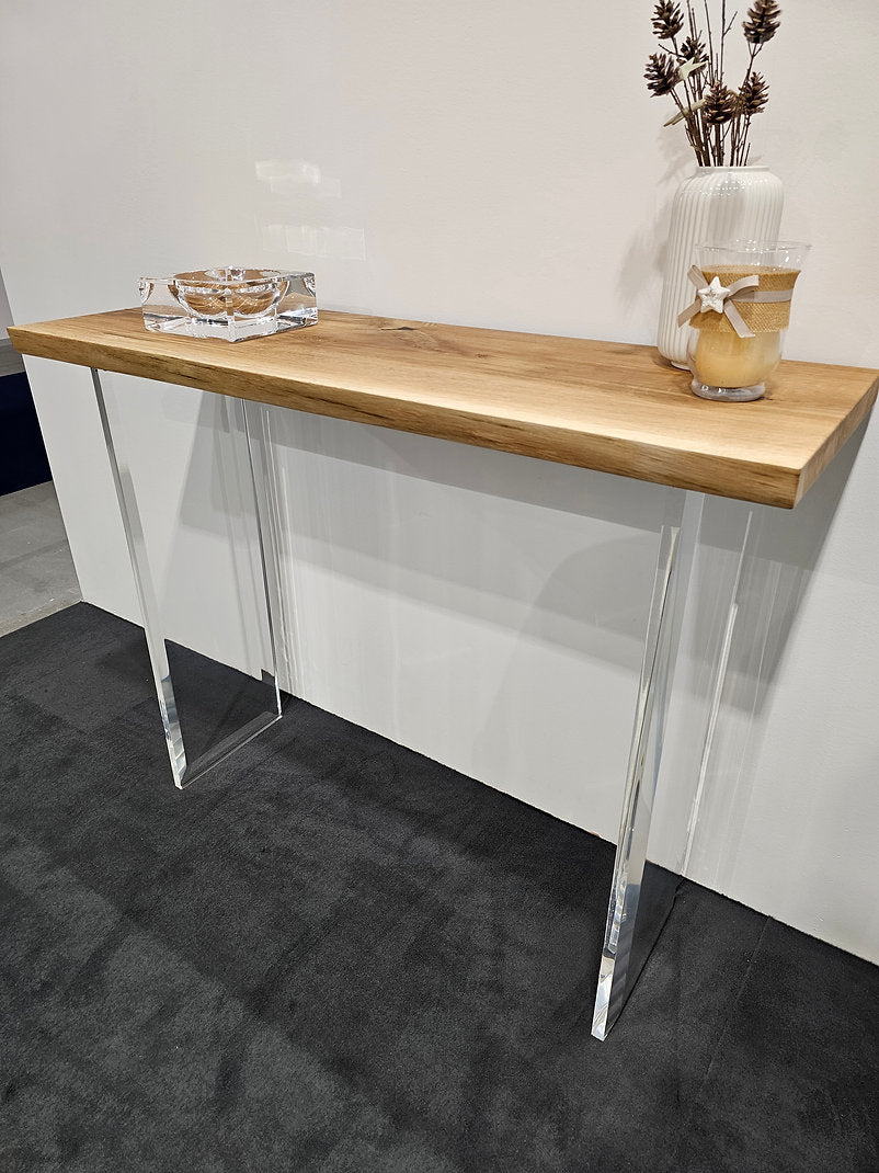 Clear acrylic console table with a light wood top