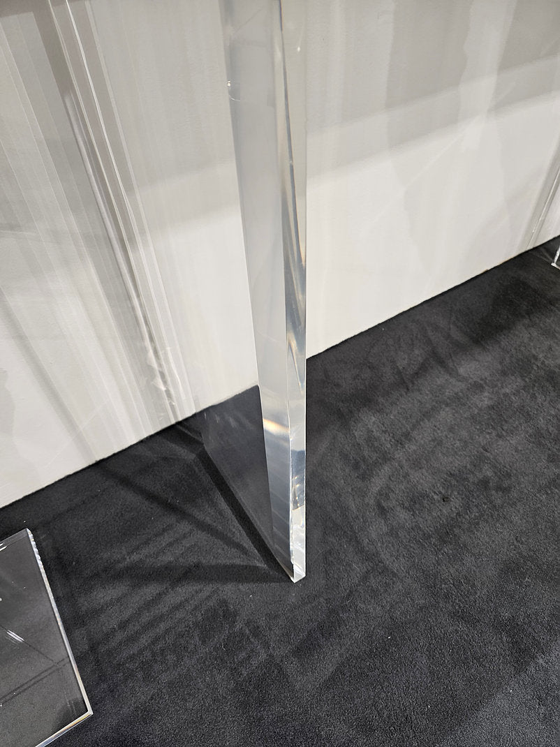 Clear acrylic console table with a light wood top